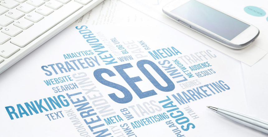 Seo business, search engine optimization, concept cloud chart. Print document, keyboard, pen and smartphone. Blue toned.